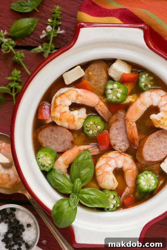 Single Skillet Surf & Turf Gumbo 2 A vibrant bowl of One Pot Chicken and Shrimp Gumbo, featuring chicken, shrimp, sausage, okra, and bell peppers, ready in 30 minutes for a healthy, easy dinner.