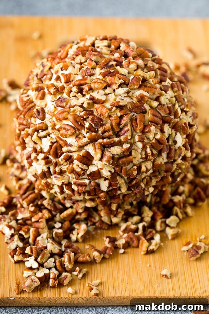 Irresistible Cheese Ball Appetizer 5 Cheese rolled in chopped pecans.