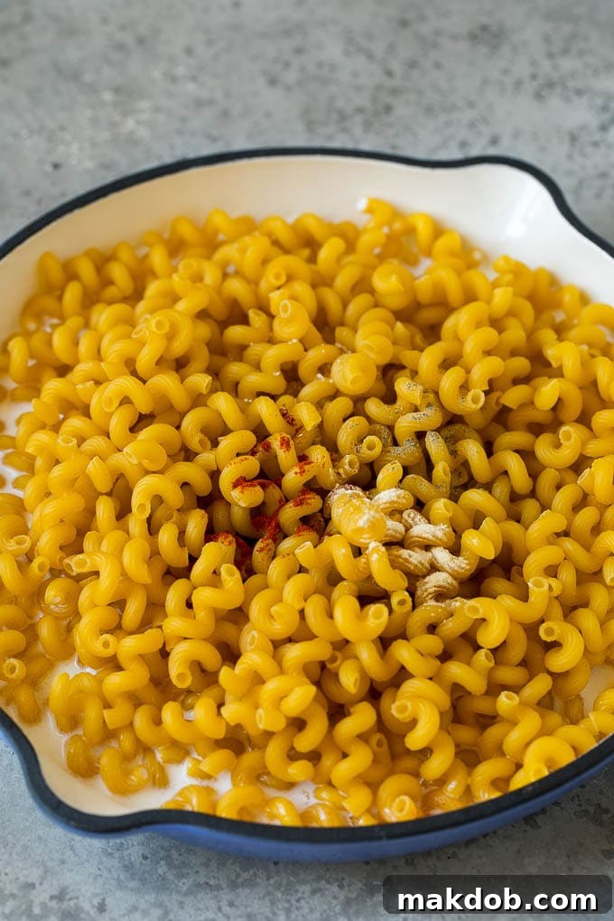 Dry pasta in milk with seasonings.