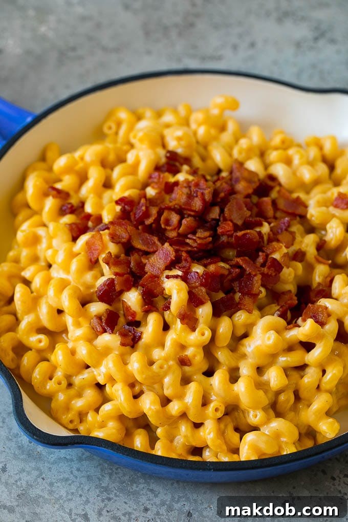 Macaroni and cheese with bacon sprinkled on top.