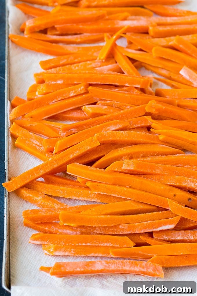 Sweet Potato Fries Recipe | Baked Sweet Potato Fries | Homemade Fries #fries #sweetpotato #sidedish #frenchfries #dinner #dinneratthezoo Pieces of sweet potato coated in a corn starch batter.