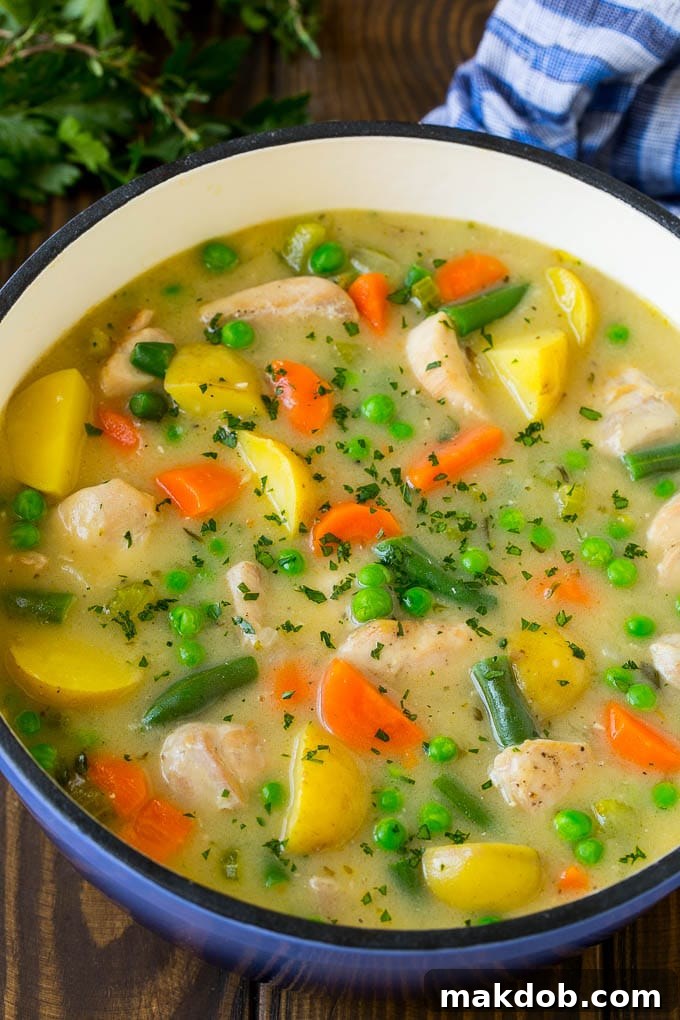 Chicken Stew Recipe | Chicken and Vegetable Soup #stew #soup #chicken #potatoes #comfortfood #dinner #dinneratthezoo A pot of chicken stew with potatoes, carrots and peas.