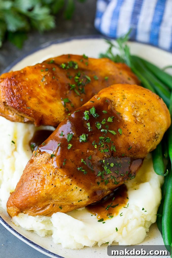 Slow Cooker Chicken Breast Recipe | Crock Pot Chicken Breast | Chicken and Gravy Slow cooker chicken breast served with creamy mashed potatoes and vibrant green beans.