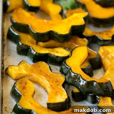 Roasted acorn squash garnished with fresh parsley.