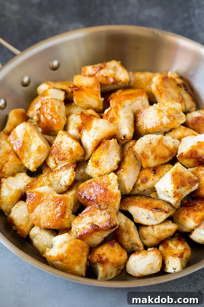 Kung Pao Chicken Recipe | Chicken Stir Fry #chicken #stirfry #chinesefood #peanuts #peppers #dinner #dinneratthezoo Seared chicken breast pieces in a pan.