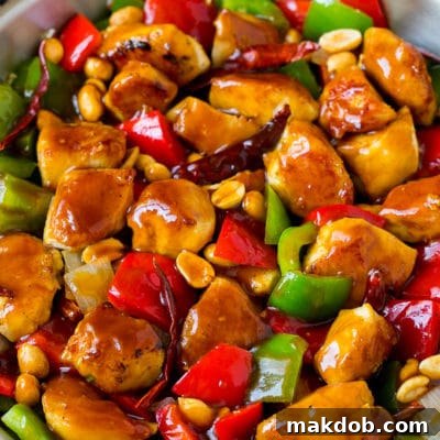 Kung pao chicken with seared chicken breast, bell peppers and peanuts in a savory sauce.