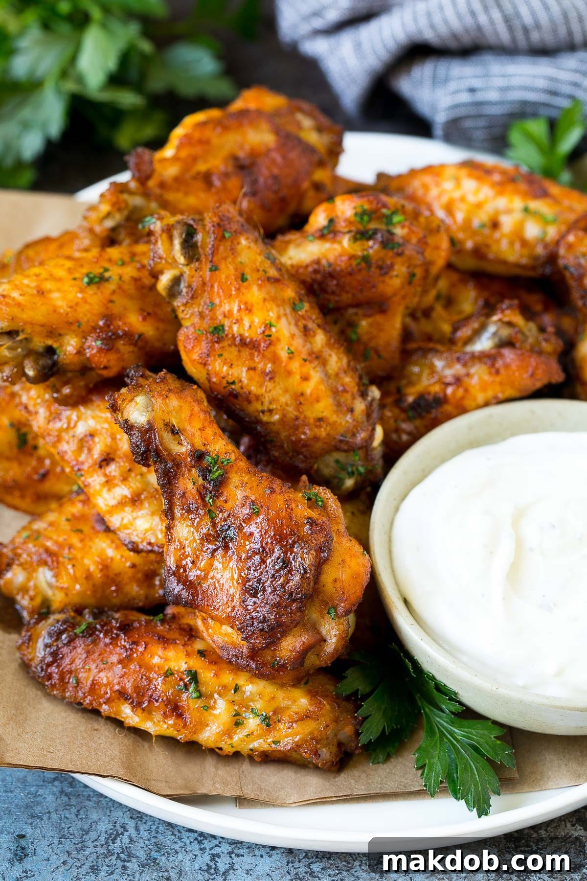 Crispy Oven Wings 2 A plate of baked chicken wings served with ranch dip.