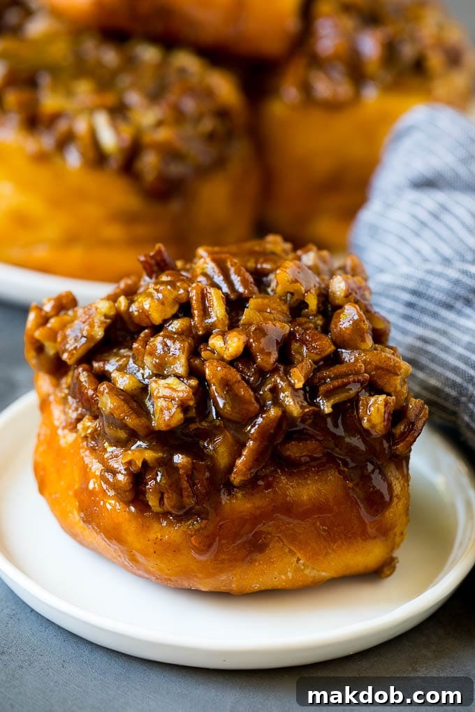Sticky Buns Recipe | Sweet Rolls | Cinnamon Rolls #breakfast #brunch #cinnamon #pecans #dinneratthezoo #bread Sticky buns topped with caramel and pecans.