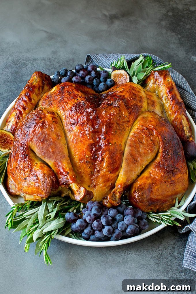 Spatchcock Turkey | Roasted Turkey | Thanksgiving Turkey #turkey #thanksgiving #dinner #fall #christmas #dinneratthezoo Spatchcock turkey garnished with grapes and fresh herbs.