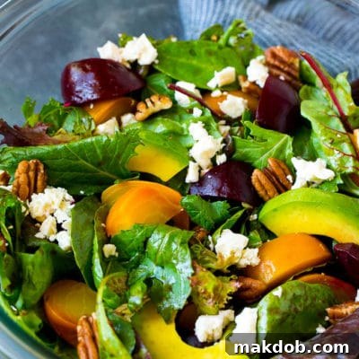 Beet salad with mixed greens, feta cheese and avocado.
