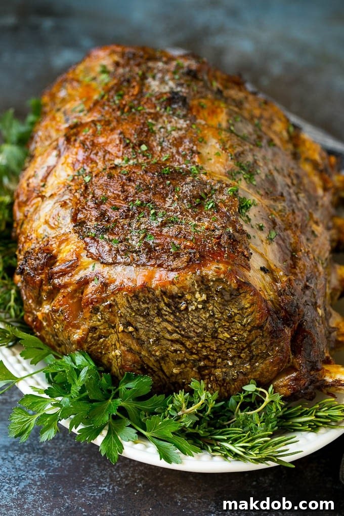 Prime Rib Recipe #primerib #beef #roast #dinner #thanksgiving #christmas #keto #lowcarb #dinneratthezoo A slow roasted prime rib on a serving platter.