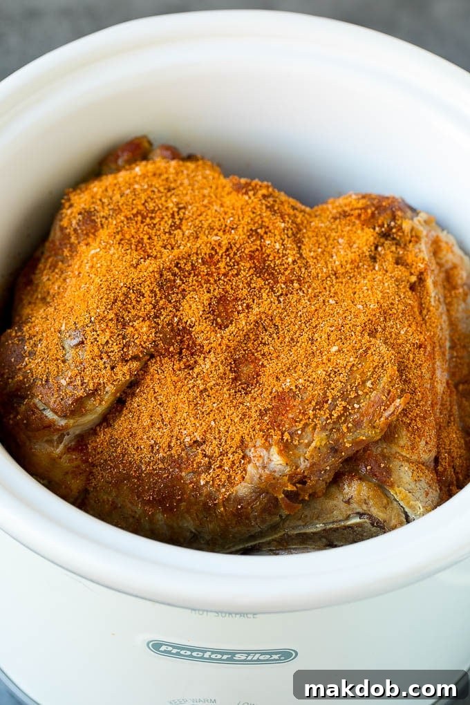 Slow Cooker Pulled Pork Recipe | Crock Pot Pulled Pork #pork #pulledpork #crockpot #slowcooker #dinner #dinneratthezoo Pork shoulder coated in spice rub.