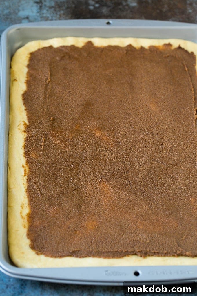 Cinnamon Rolls Recipe | Cinnamon Buns #cinnamon #rolls #pastry #breakfast #brunch #sweets #dinneratthezoo #baking #bread Brown sugar and butter filling spread onto dough, ready to be rolled.