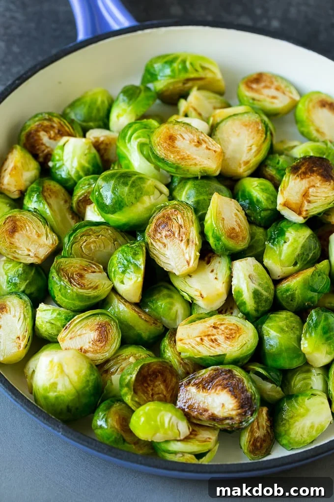 Sauteed Brussels Sprouts Recipe | Brussels Sprouts Side Dish #brusselssprouts #sprouts #veggies #sidedish #garlic #vegetarian #dinner #dinneratthezoo Golden-brown brussels sprouts, halved and perfectly seared in a hot pan.