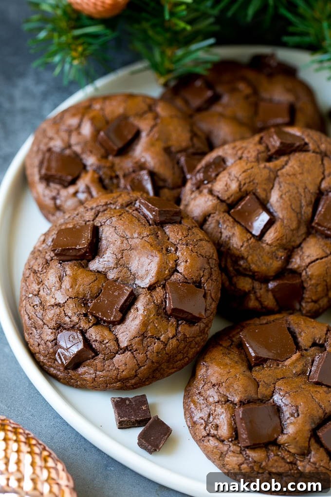 Brownie cookies on a serving plate, topped with chocolate chunks. A perfect dessert for chocolate lovers.