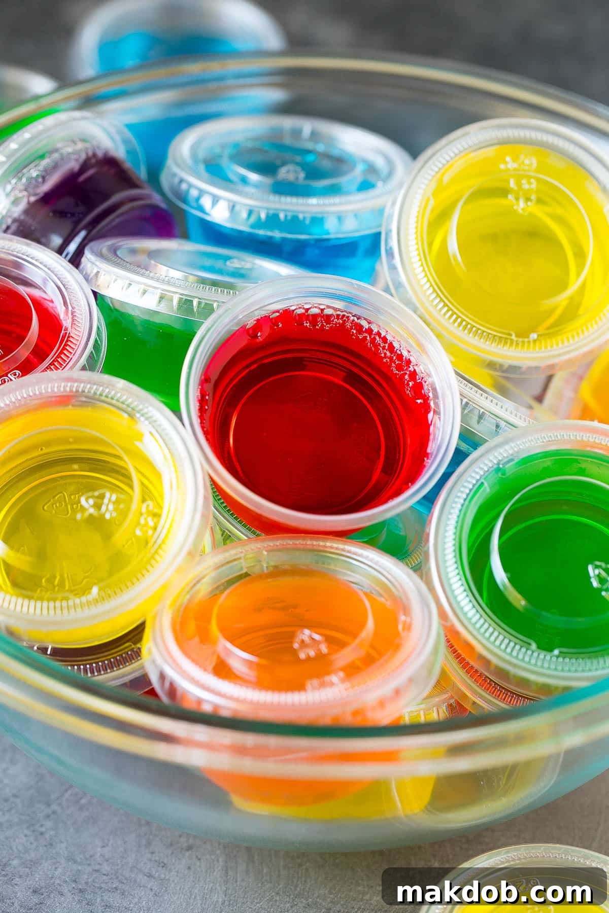 Ultimate Jello Shot Guide 4 A bowl full of prepared Jello shots, showcasing their vibrant colors and perfect jiggle.