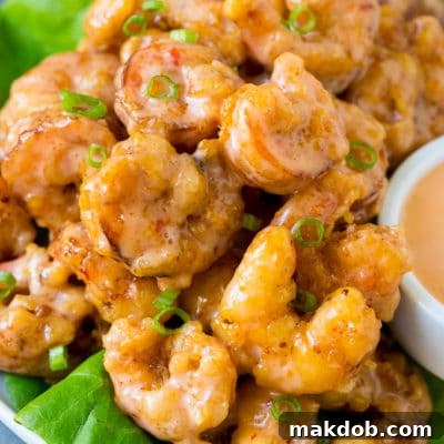Bang bang shrimp tossed in creamy chili sauce and served over lettuce.