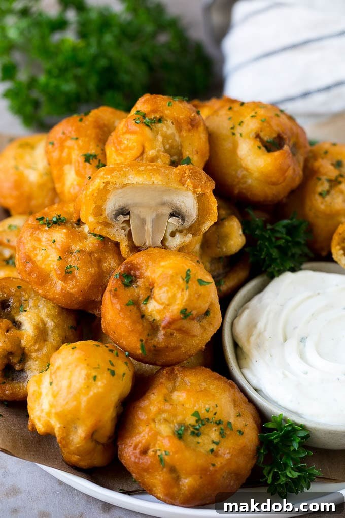Fried Mushrooms Recipe #mushrooms #appetizer #snack #dinneratthezoo A plate of fried mushrooms served with ranch dip.