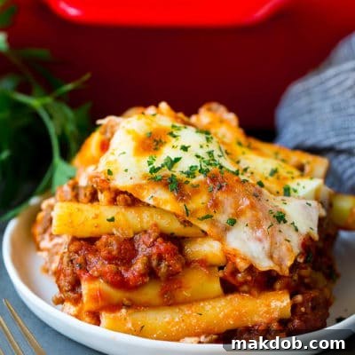 A serving of baked ziti with meat sauce and ricotta cheese.