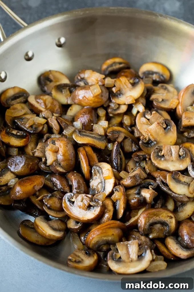 Sauteed mushrooms in a skillet.