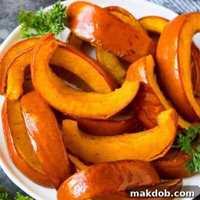 Slices of roasted pumpkin on a serving plate.