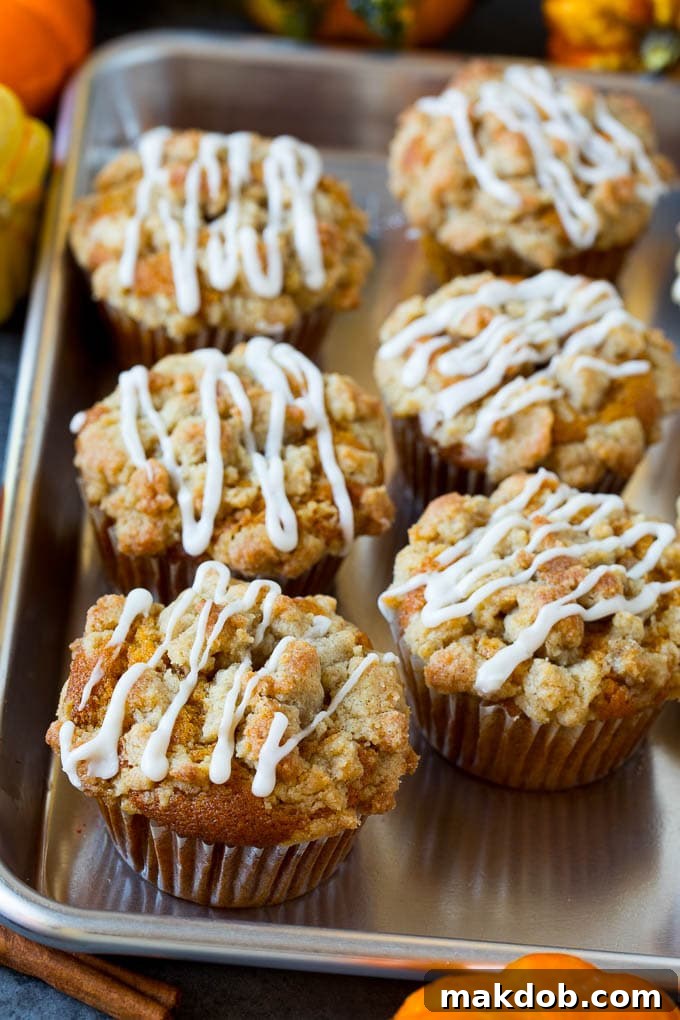 Glazed Pumpkin Muffins on a Tray A beautifully arranged tray of glazed pumpkin muffins, ready to be served for breakfast or dessert.