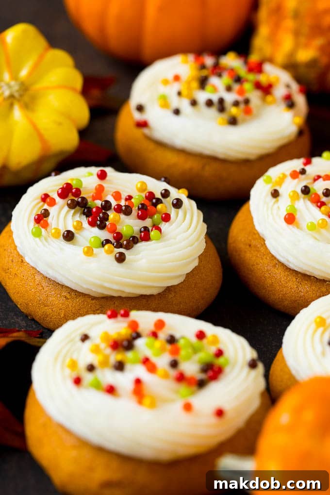 Experience the joy of baking with these fluffy pumpkin cookies, enhanced by a decadent cream cheese frosting and cheerful sprinkles. Soft pumpkin cookies topped with a generous swirl of cream cheese frosting and colorful fall sprinkles.