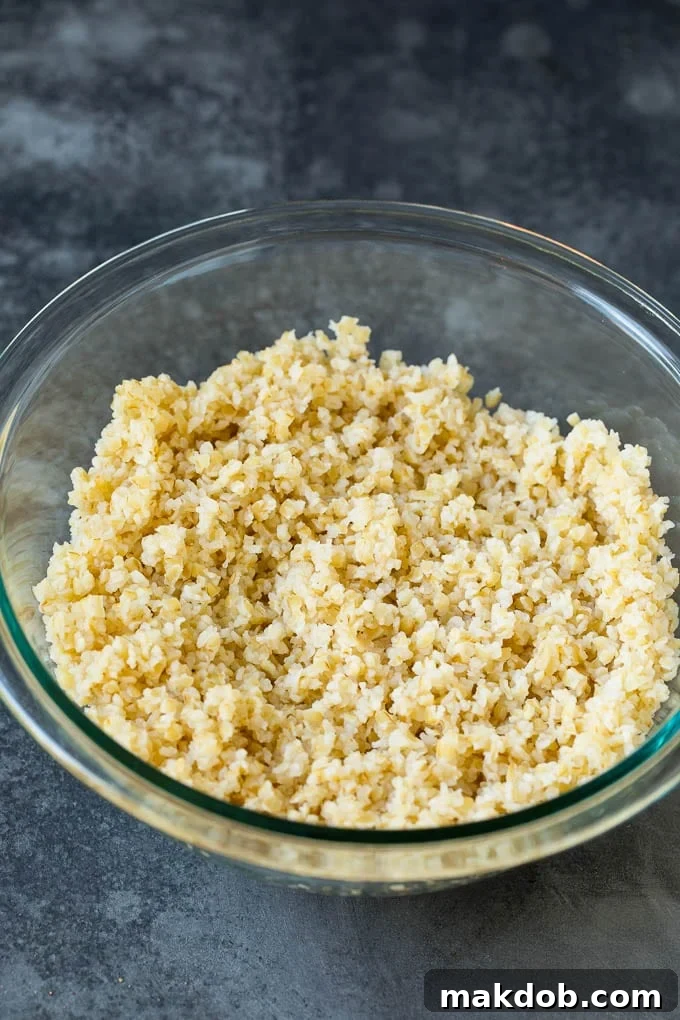 Bulgur wheat in a bowl, showing its fine texture, a key ingredient for traditional tabbouleh salad.