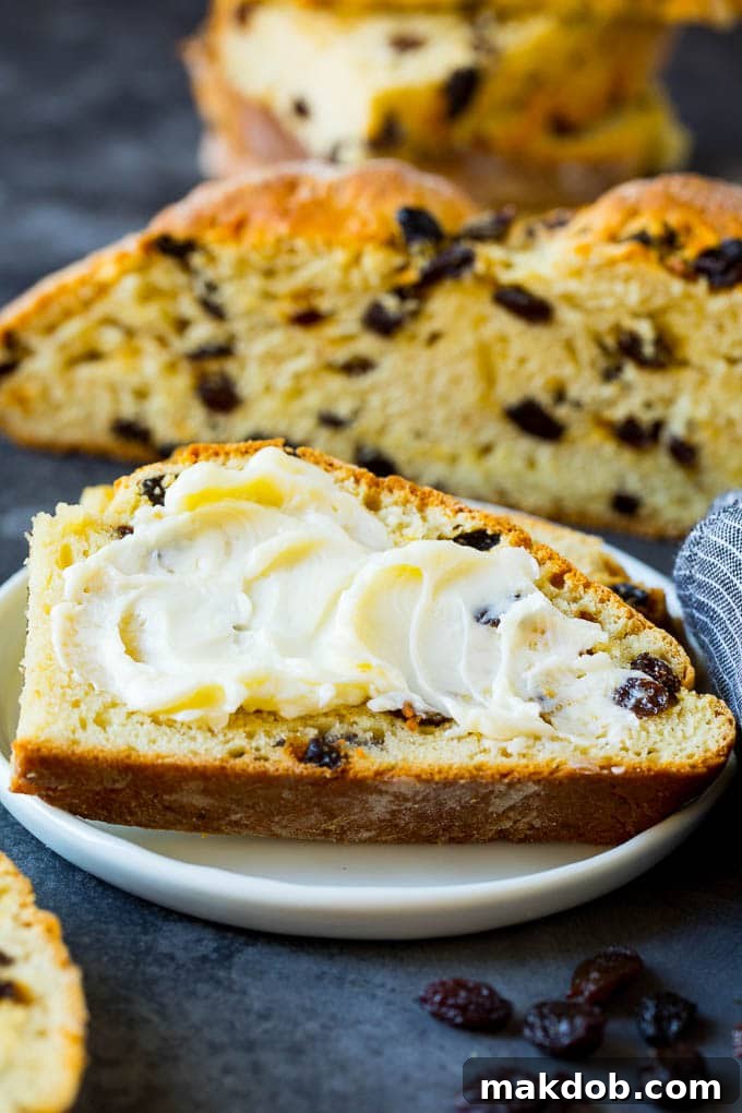 Rustic Irish Soda Bread 6 A slice of Irish soda bread with butter spread on it.