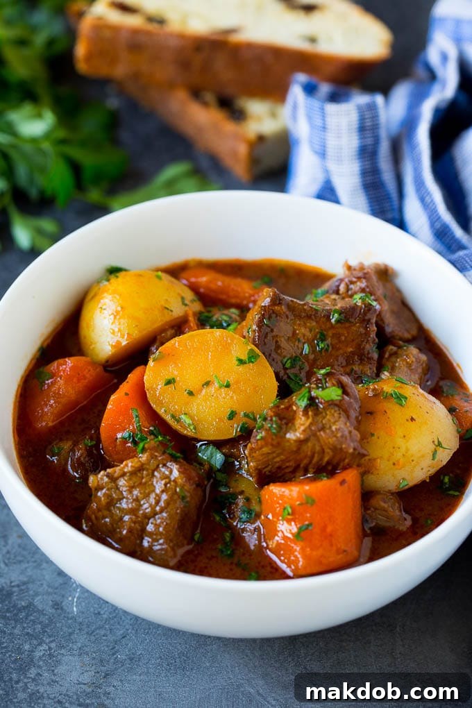Finished Irish Stew with Parsley Garnish A beautifully presented bowl of Irish stew, garnished with vibrant fresh parsley, ready to be served.