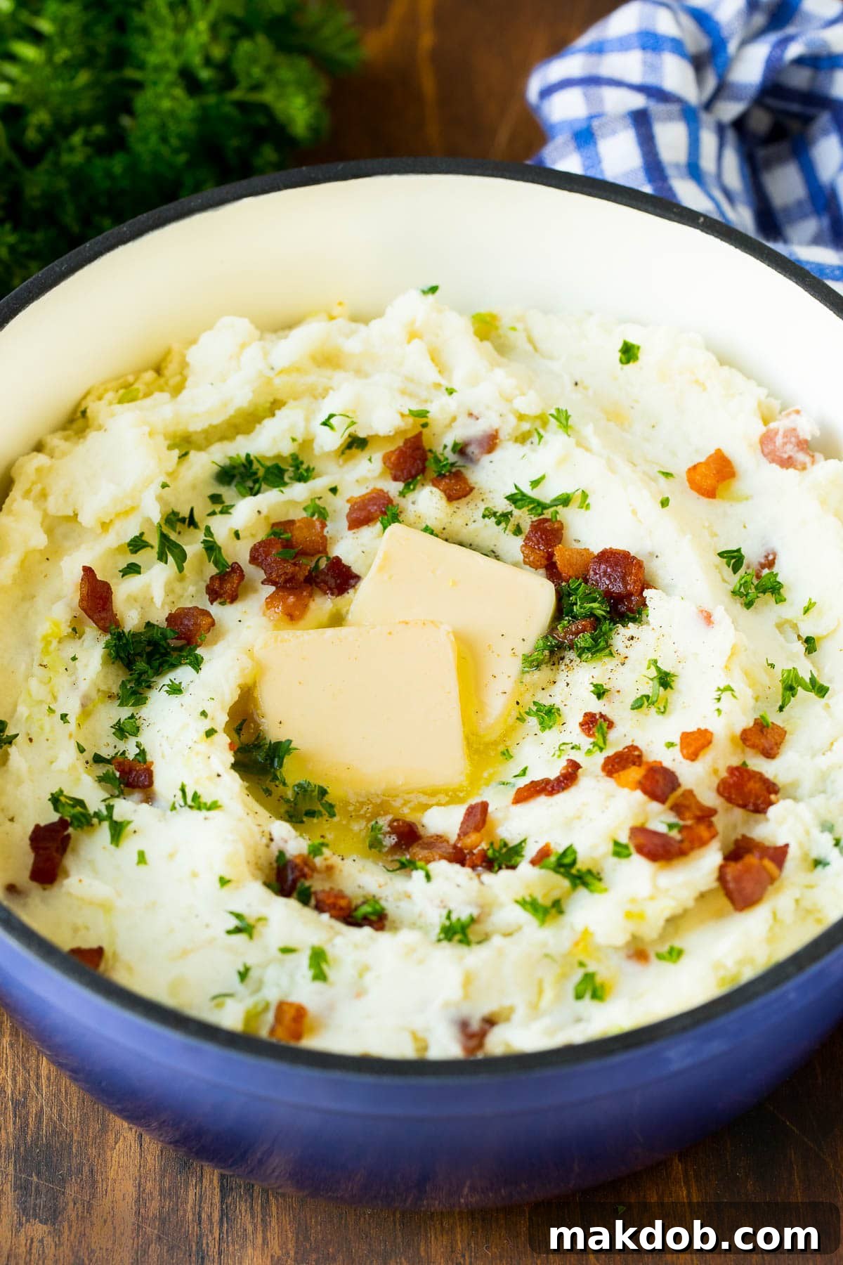 Colcannon Recipe | Mashed Potatoes #potatoes #cabbage #bacon #sidedish #stpatricksday #dinner #dinneratthezoo A pot of colcannon garnished with butter, bacon and herbs.