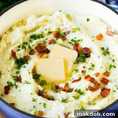 Hearty Irish Colcannon 3 A pot of colcannon garnished with butter, bacon and herbs.