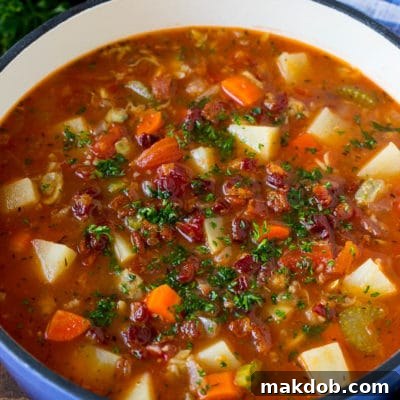 Manhattan clam chowder with tomatoes, potatoes, vegetables and bacon.