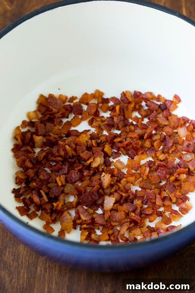 Cooked bacon in a soup pot.