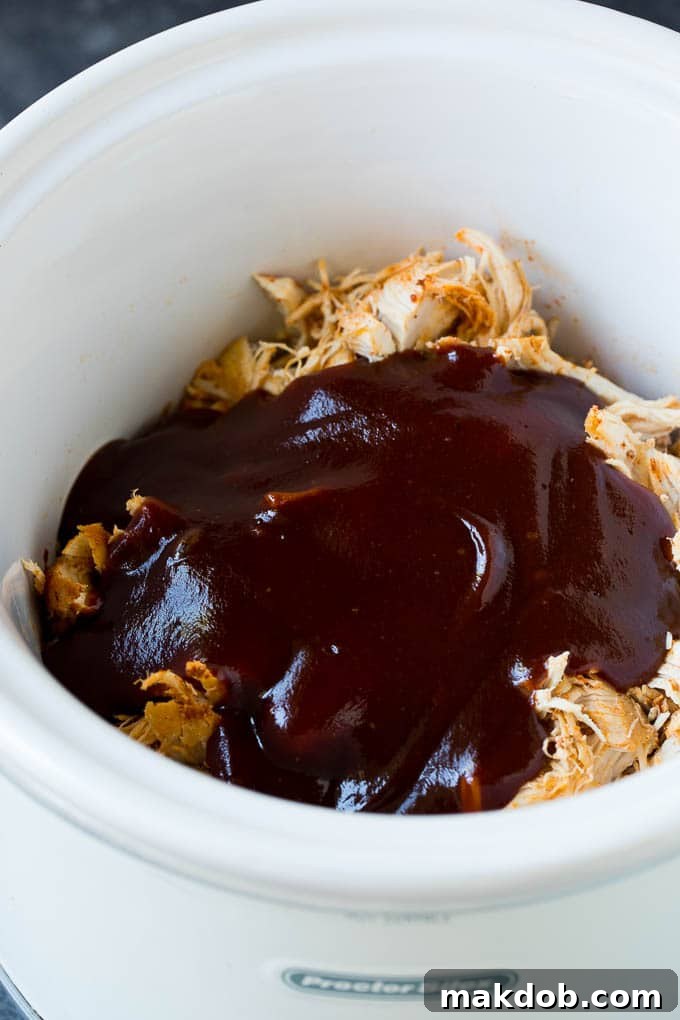 Perfectly shredded chicken with homemade BBQ sauce poured generously over the top.