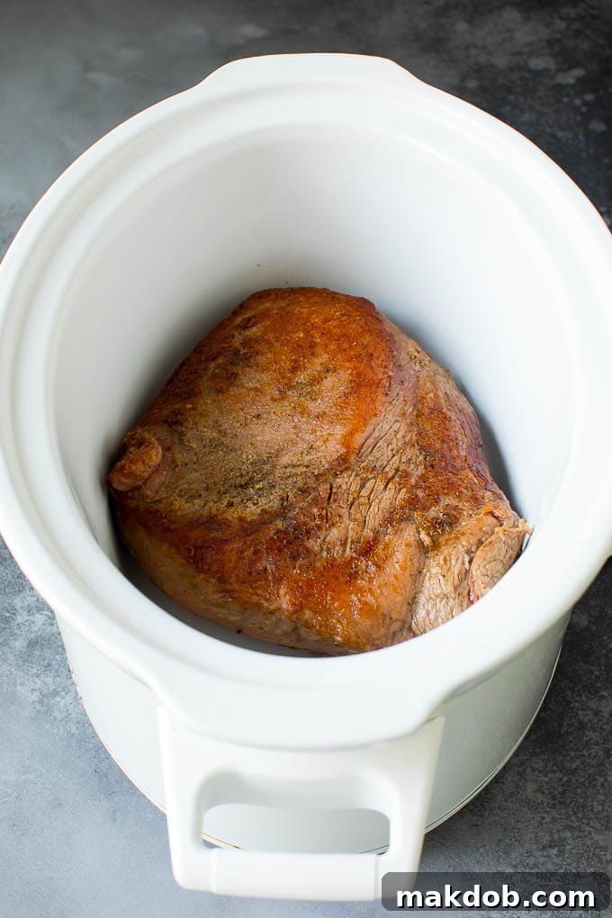 Slow Cooker Brisket Recipe | Crockpot Brisket #beef #slowcooker #crockpot #dinner #dinneratthezoo Seared brisket in a crockpot with a golden-brown crust.