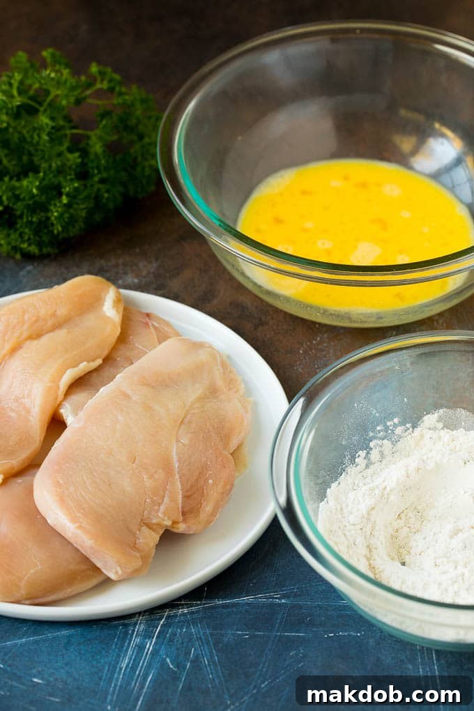Key ingredients for Chicken Francese, including battered chicken, seasoned flour, and whisked egg wash.