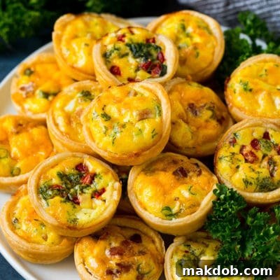 Triple Treat Mini Quiche Bites 2 A plate of mini quiche filled with meats, vegetables and cheeses.