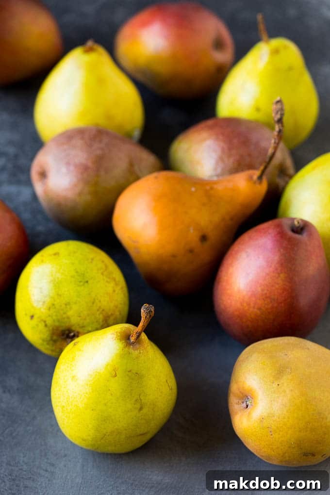 A close-up of assorted whole pears, showcasing their natural beauty and varied hues.