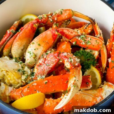 A pot of crab legs tossed in garlic butter.