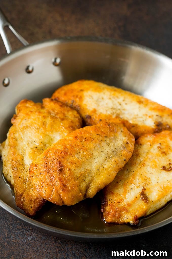 Chicken Scallopini Recipe #chicken #chickenbreast #dinner #dinneratthezoo Seared chicken cutlets in a pan.