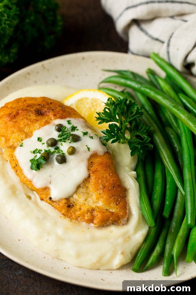 Chicken Scallopini Recipe #chicken #chickenbreast #dinner #dinneratthezoo Chicken scallopini served over mashed potatoes with a side of green beans.