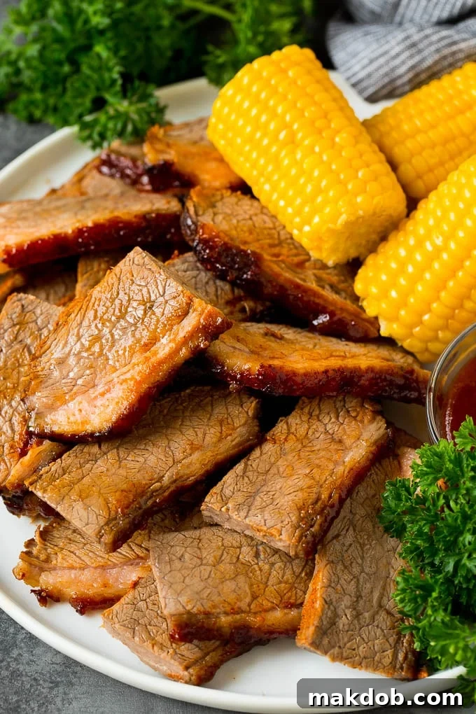 Perfectly sliced beef brisket arranged elegantly on a serving platter, showcasing its tender texture and rich color.