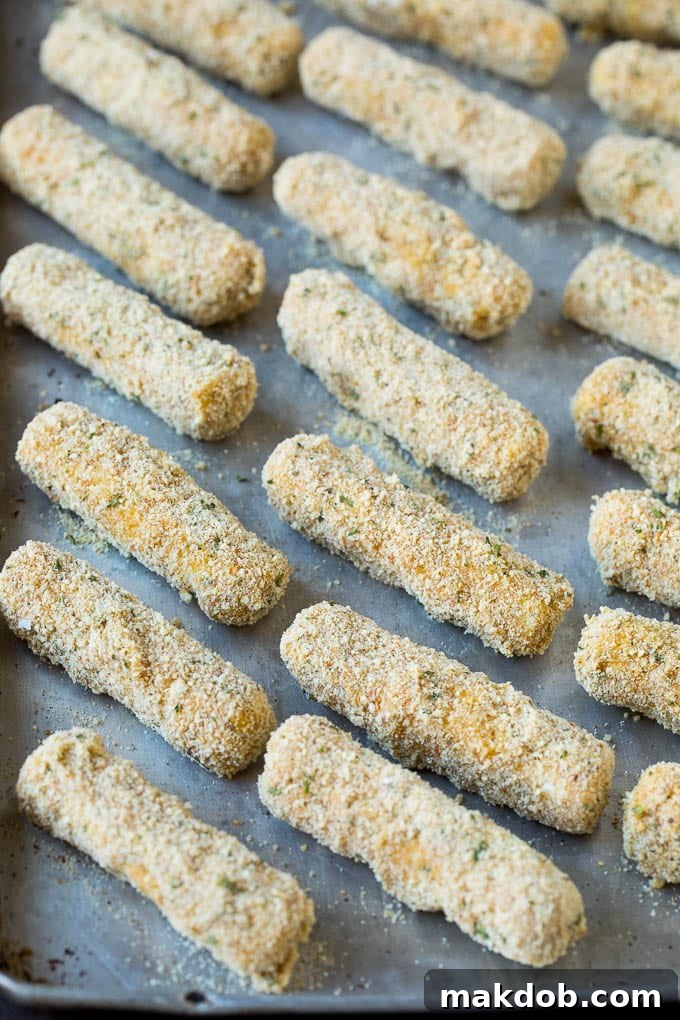 Breaded cheese on a baking pan.