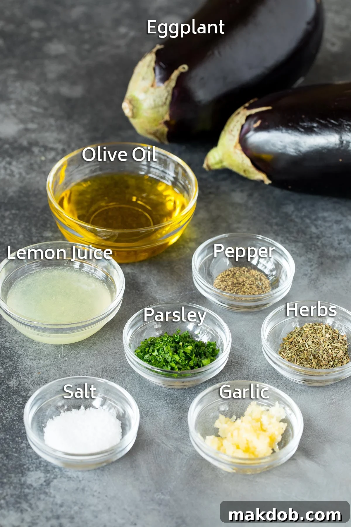 Fire-Kissed Eggplant 3 Bowls of ingredients including olive oil, lemon juice, herbs and spices, prepared for marinating eggplant.