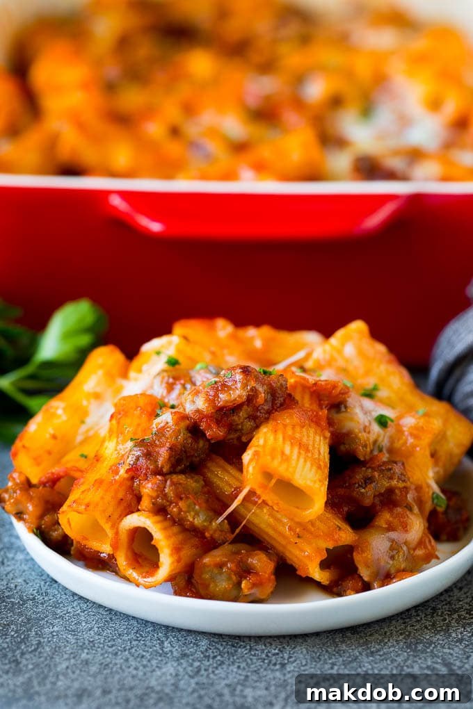Served Pasta al Forno with Parsley A plate of golden-brown Pasta al Forno, topped with melted cheese and fresh parsley, ready to be enjoyed.
