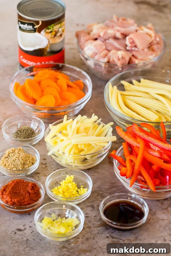 This Thai chicken curry is pieces of tender chicken and colorful vegetables, all simmered together in a coconut red curry sauce. Bowls of diced chicken, vegetables and seasonings.