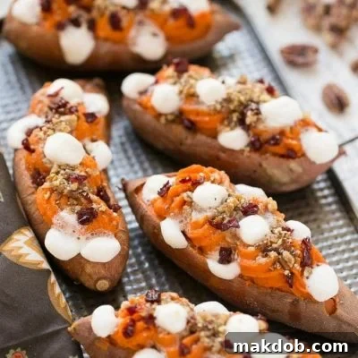 These loaded twice baked sweet potatoes are piled high with pecan brown sugar streusel, marshmallows and dried cranberries. You can prepare them in advance and then pop them in the oven right before your holiday meal!