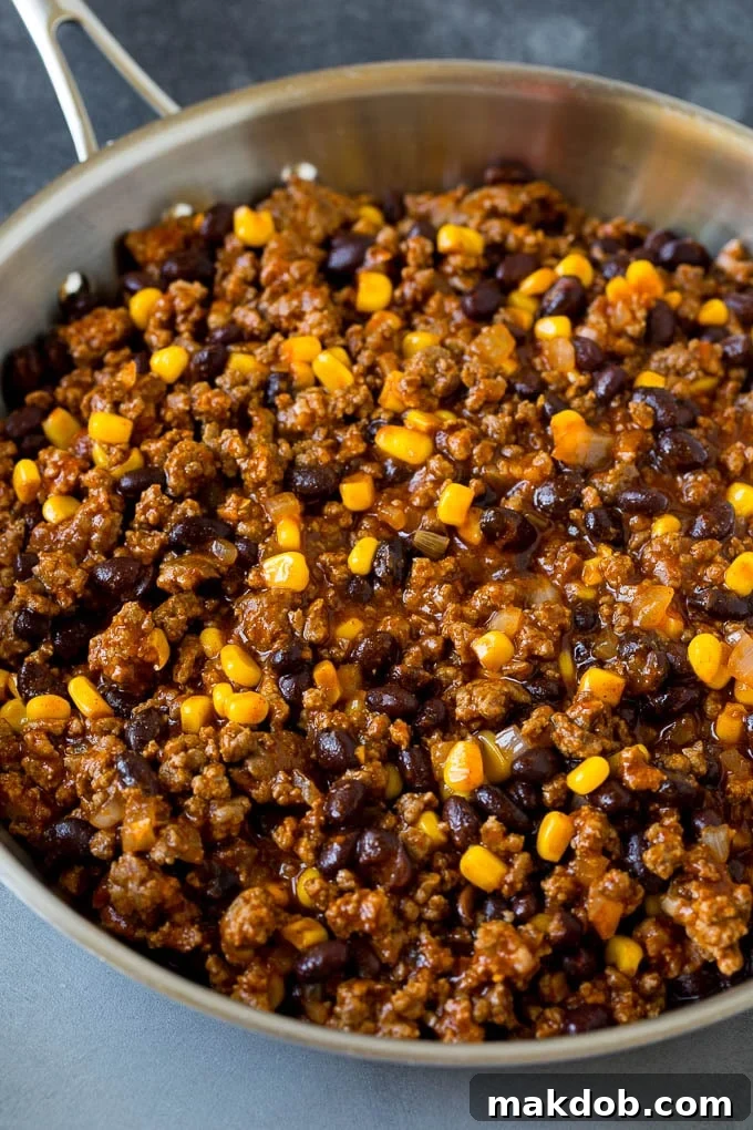 Ground beef, beans and corn in a skillet.