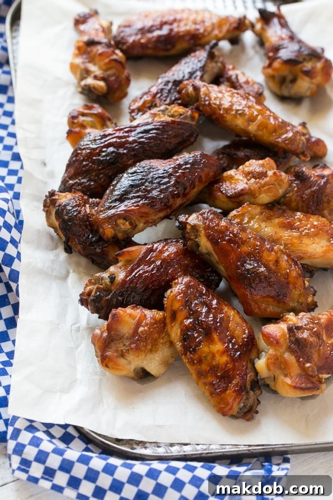 Close-up of baked chicken wings with a rich barbecue glaze, ready to serve